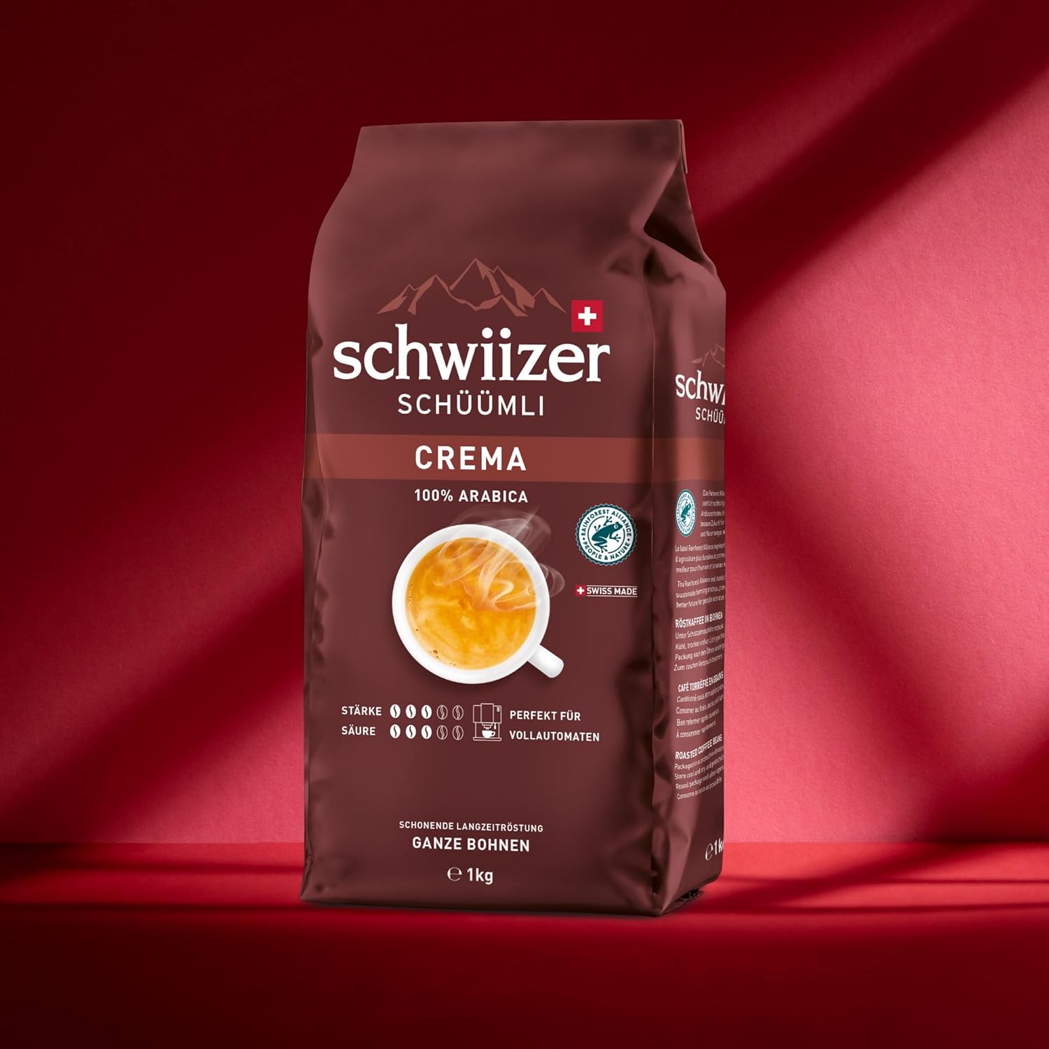 schwiizer schüümli crema, 100% arabica coffee beans, aromatic, intensive, for fully automatic machines, strength 3/5, medium roast, rainforest alliance certified, 1 kg